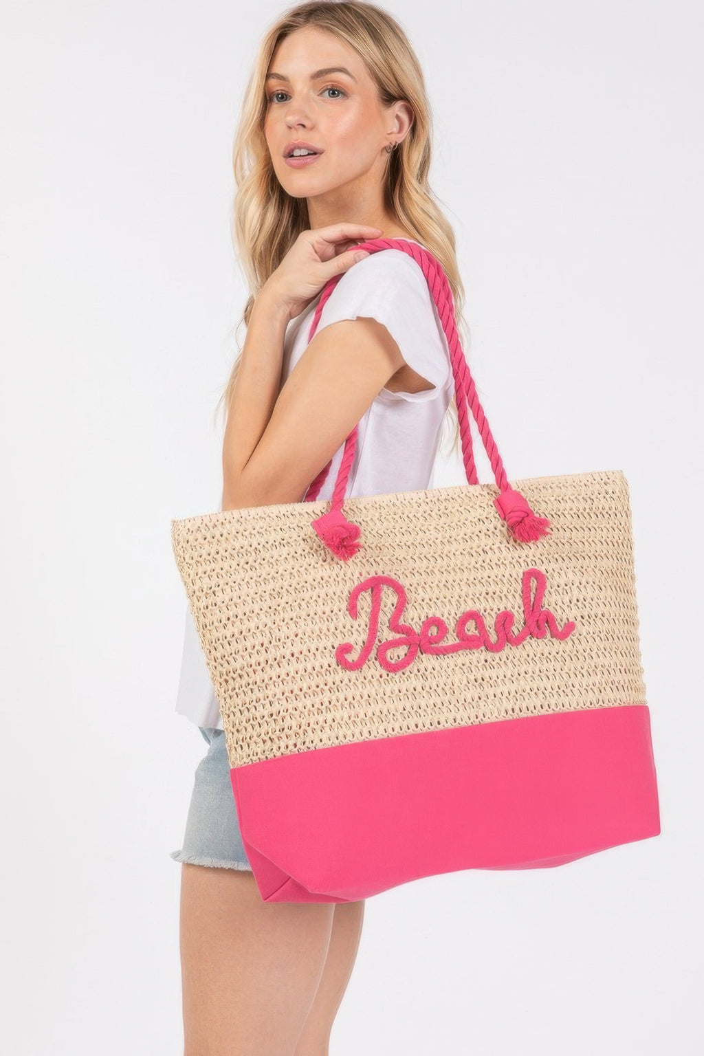 Crochet beach tote with rope straps, pink bottom and stitched 'Beach' logo