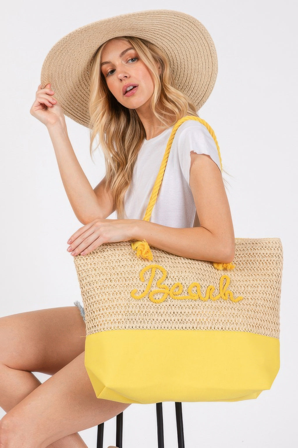 Crochet beach tote with rope straps, yellow base, 'Beach' logo in yellow
