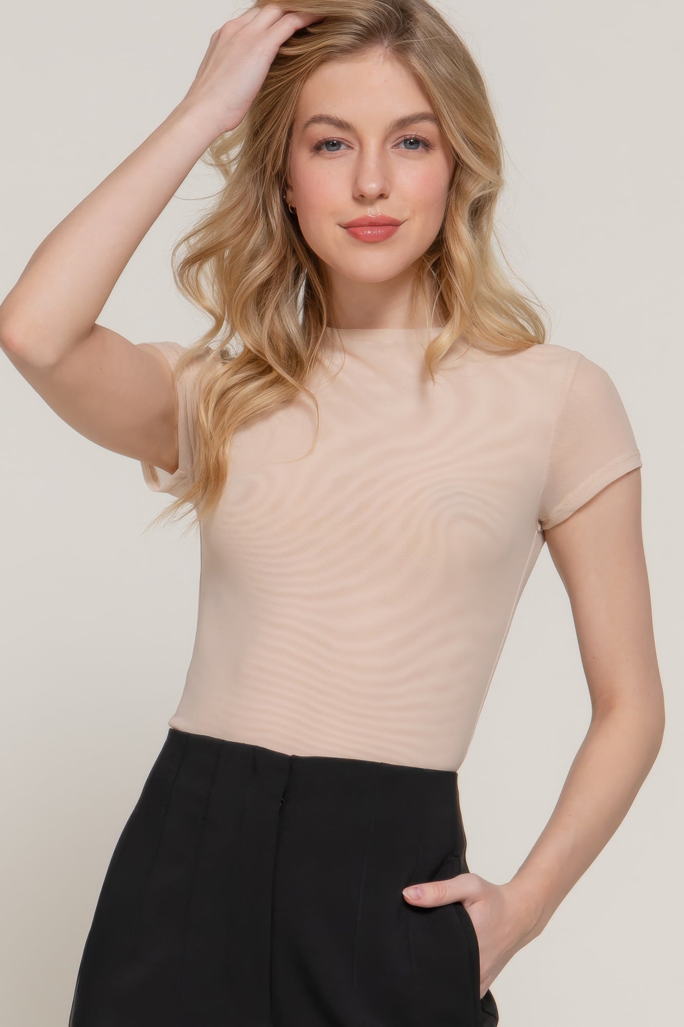 Light beige high-neck mesh top, short cap sleeves, close-up front view