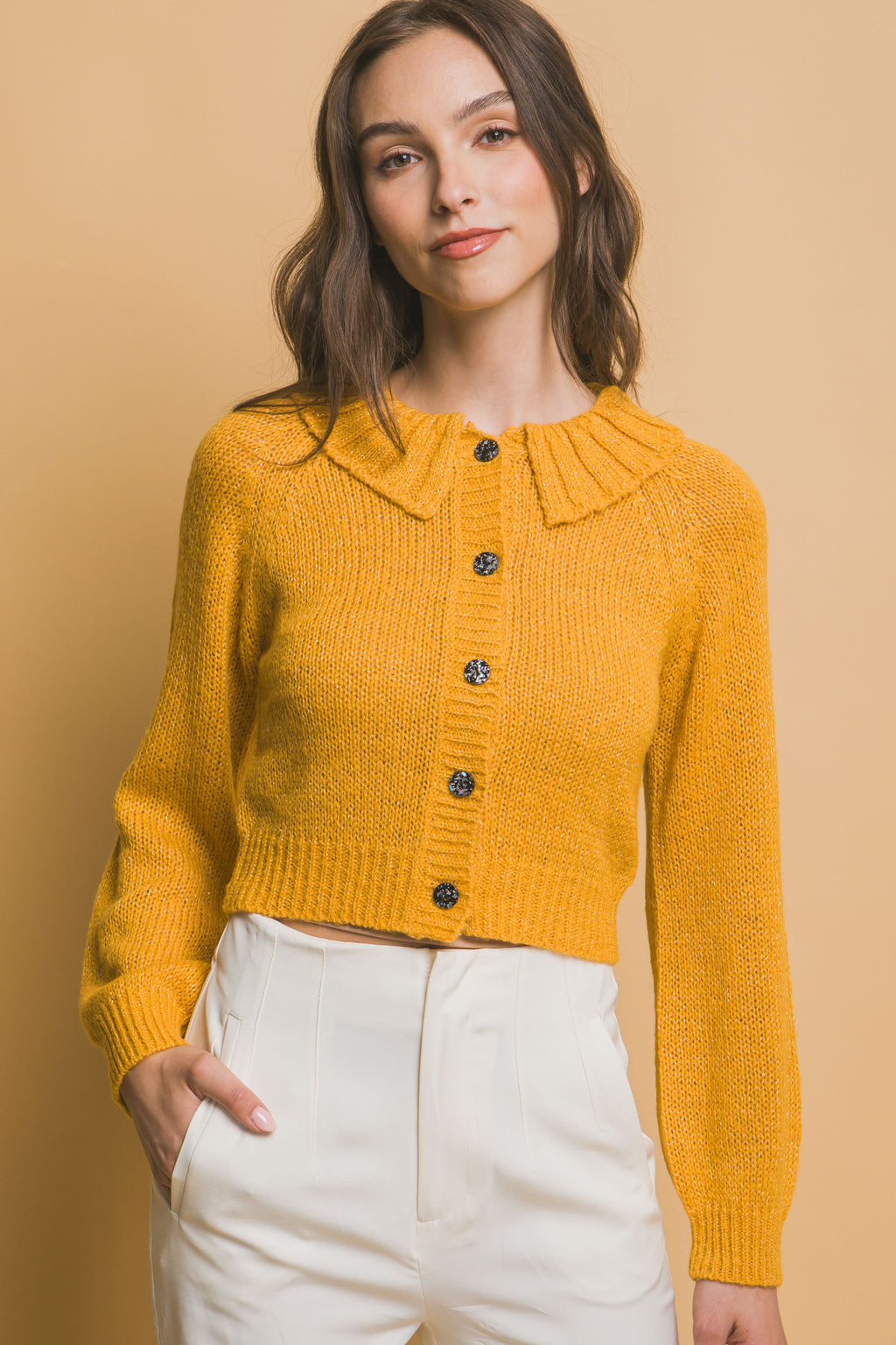 Yellow short knit sweater with ribbed pointed collar and button placket