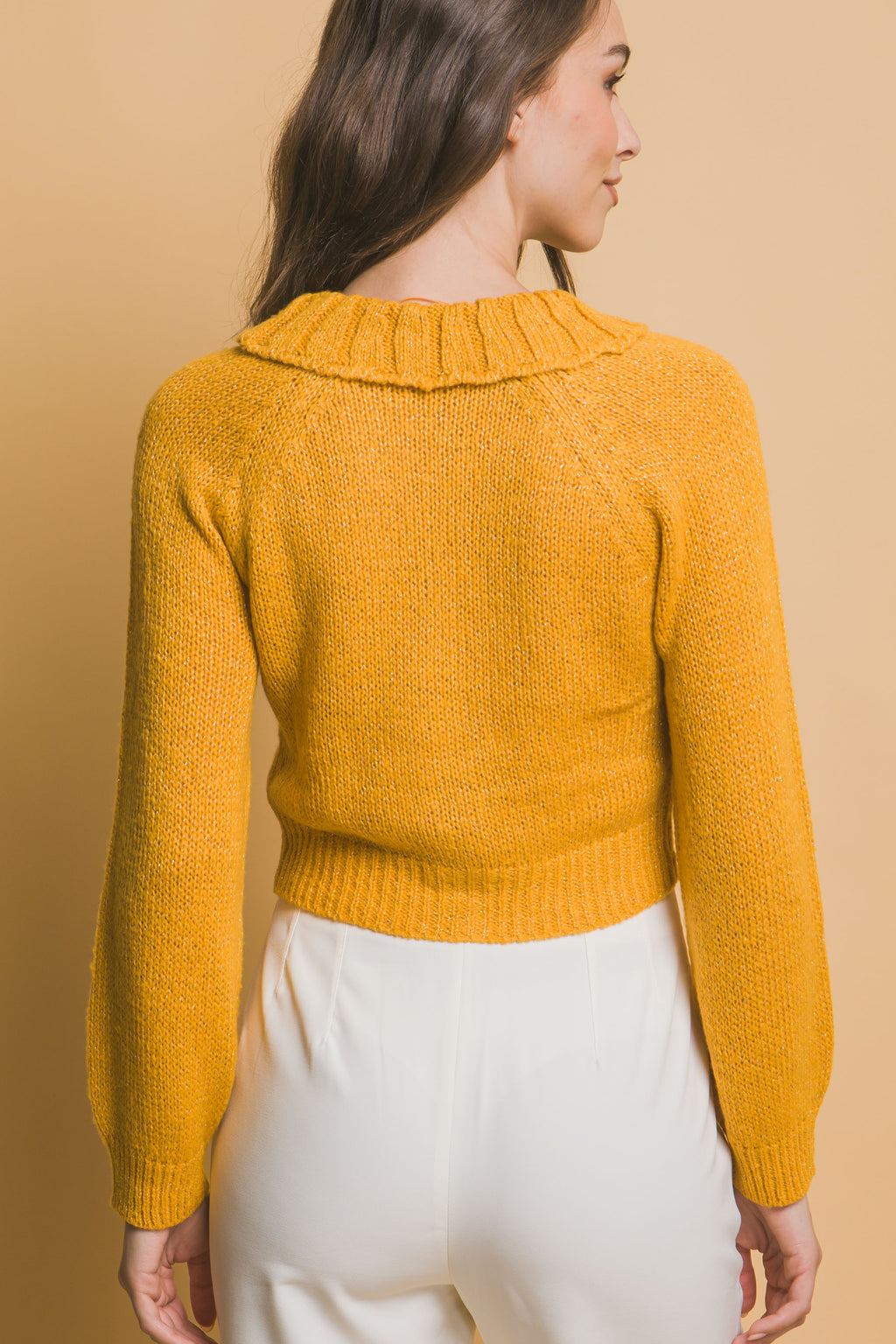 Yellow back view of cropped knit sweater with ribbed collar