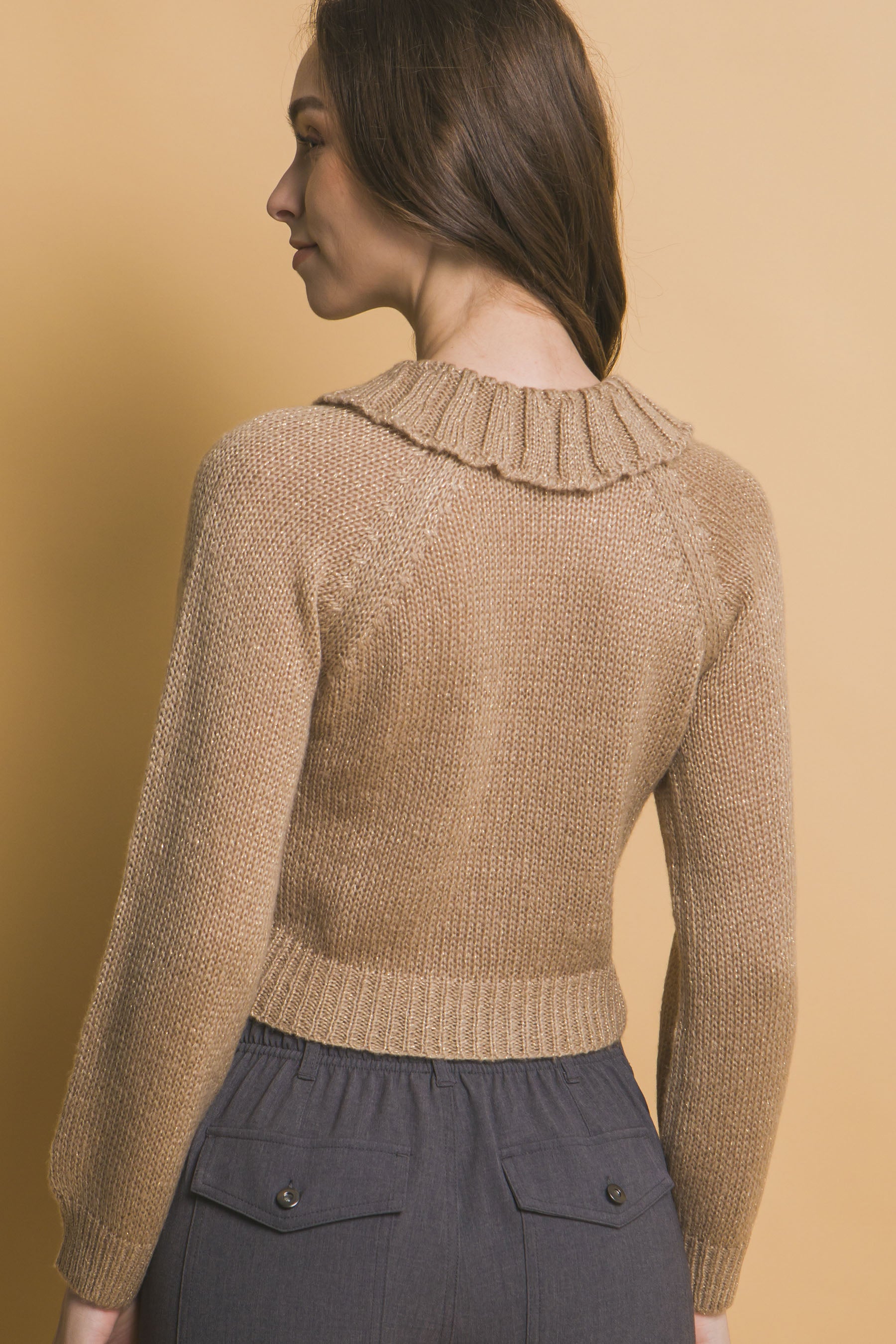 Khaki short knit sweater back view with ribbed collar and fitted hem