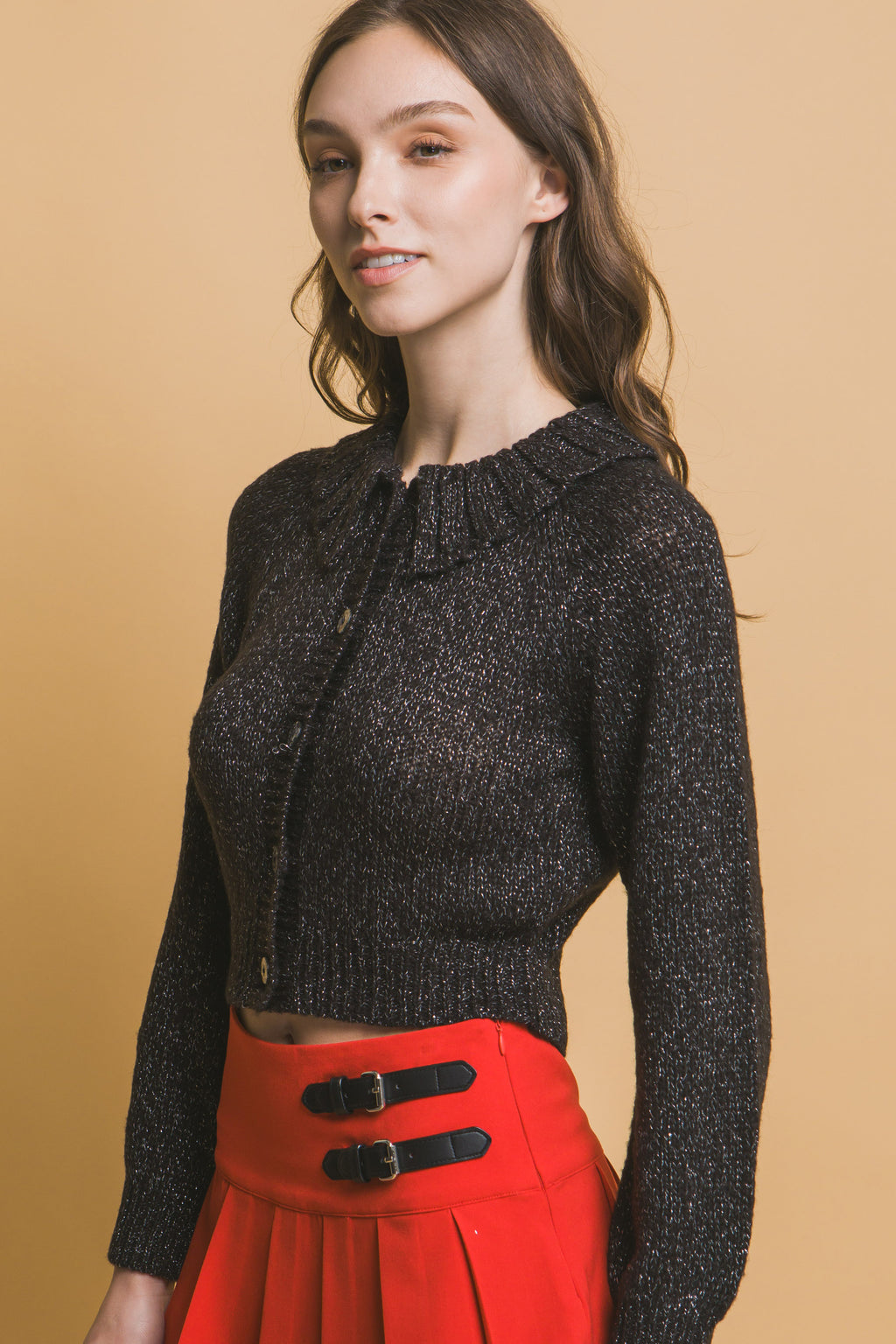 Black cropped knit sweater with high collar and front button placket