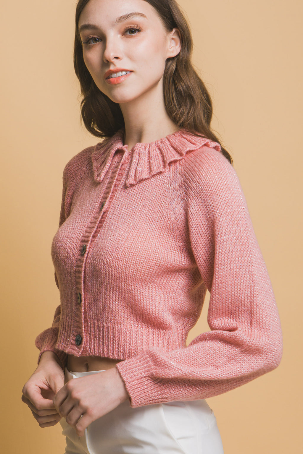 Pink cropped knit sweater with high collar, button front, long sleeves