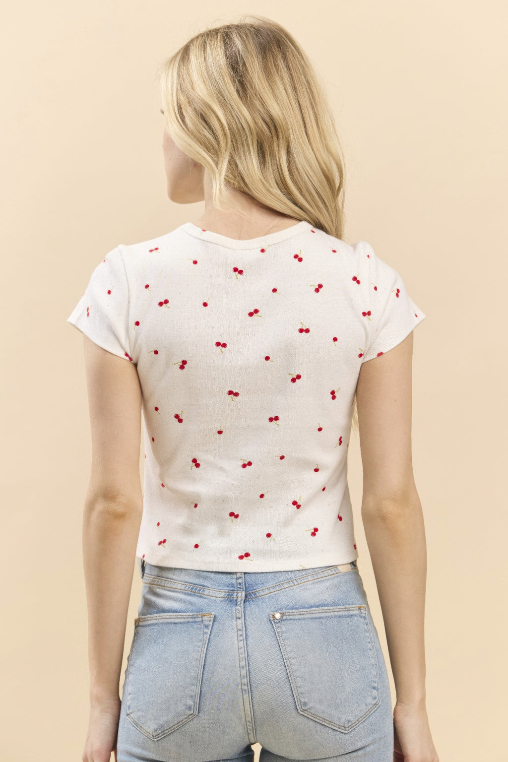 Printed baby tee back view, soft white with red cherry print, short sleeves