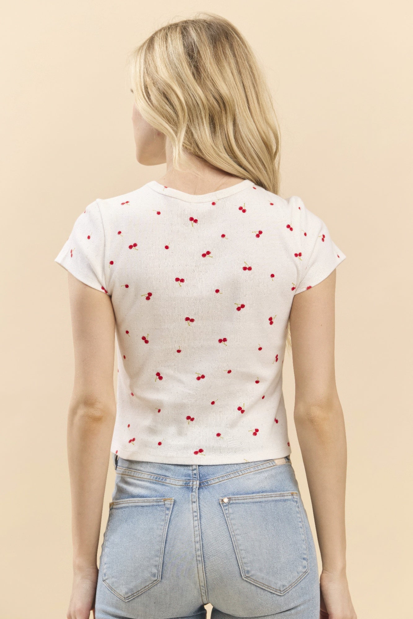 Printed baby tee back view, soft white with red cherry print, short sleeves