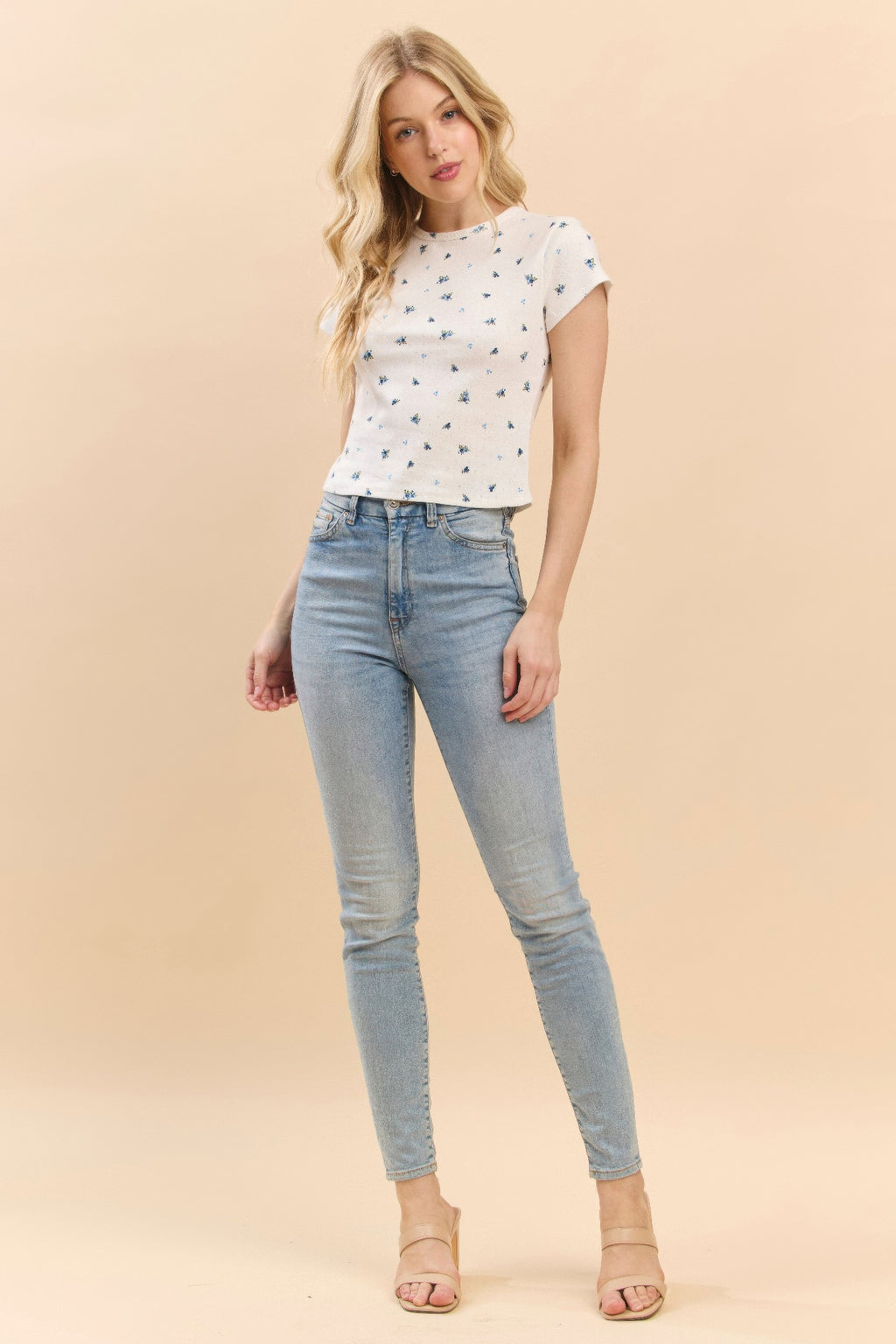 Printed baby tee in soft white with blue-and-green tiny motifs, crew neck