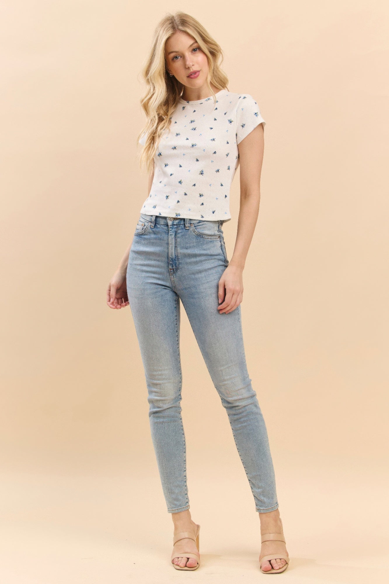 Printed baby tee in soft white with blue-and-green tiny motifs, crew neck