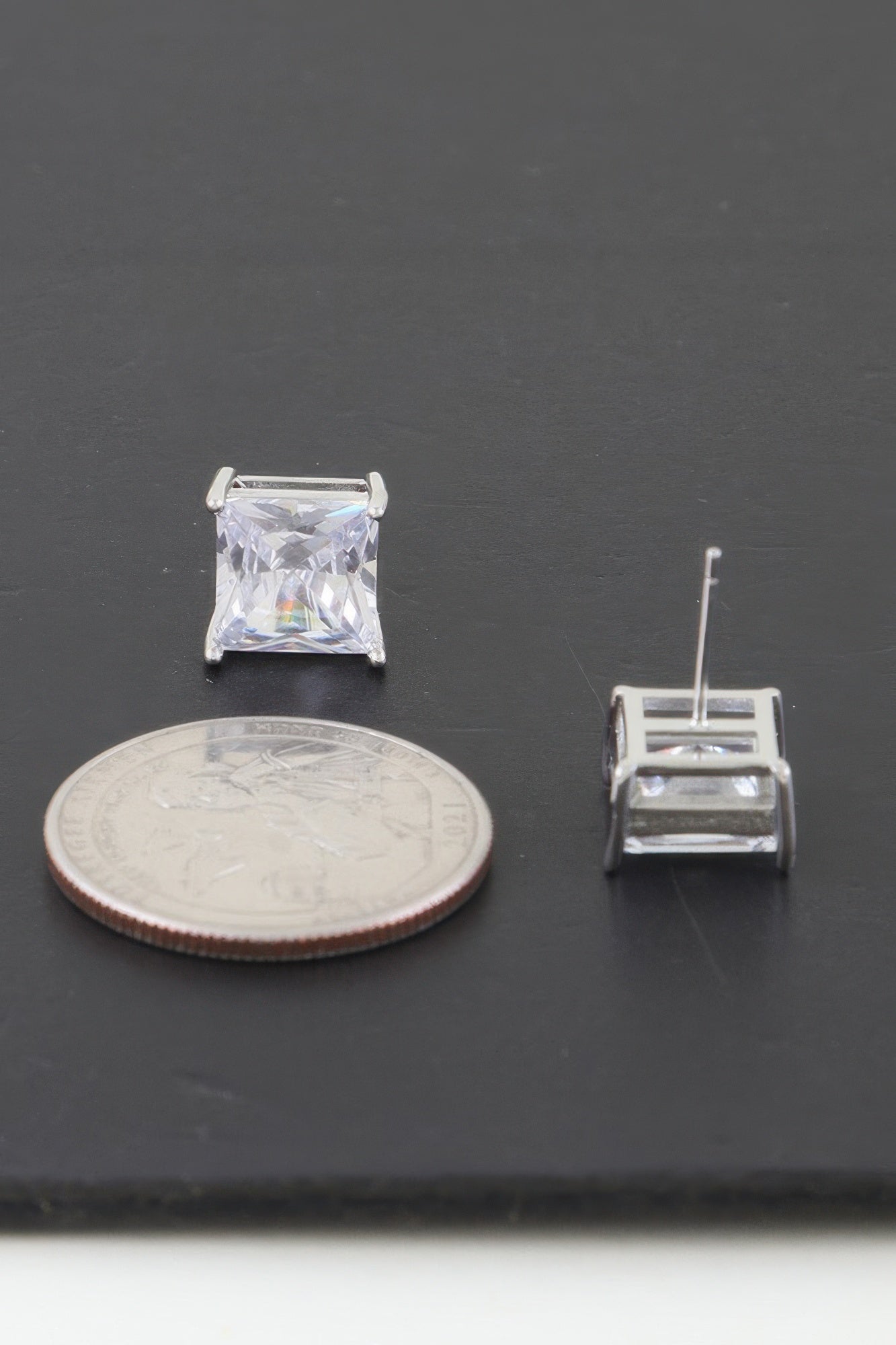 Single square cubic zirconia stud earring, clear stone, silver-toned prongs