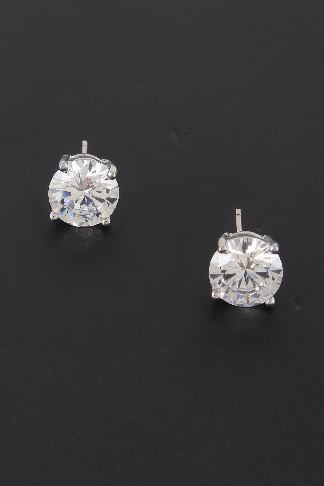 Round cubic zirconia stud earrings, silver tone, clear center stone in prong bezel