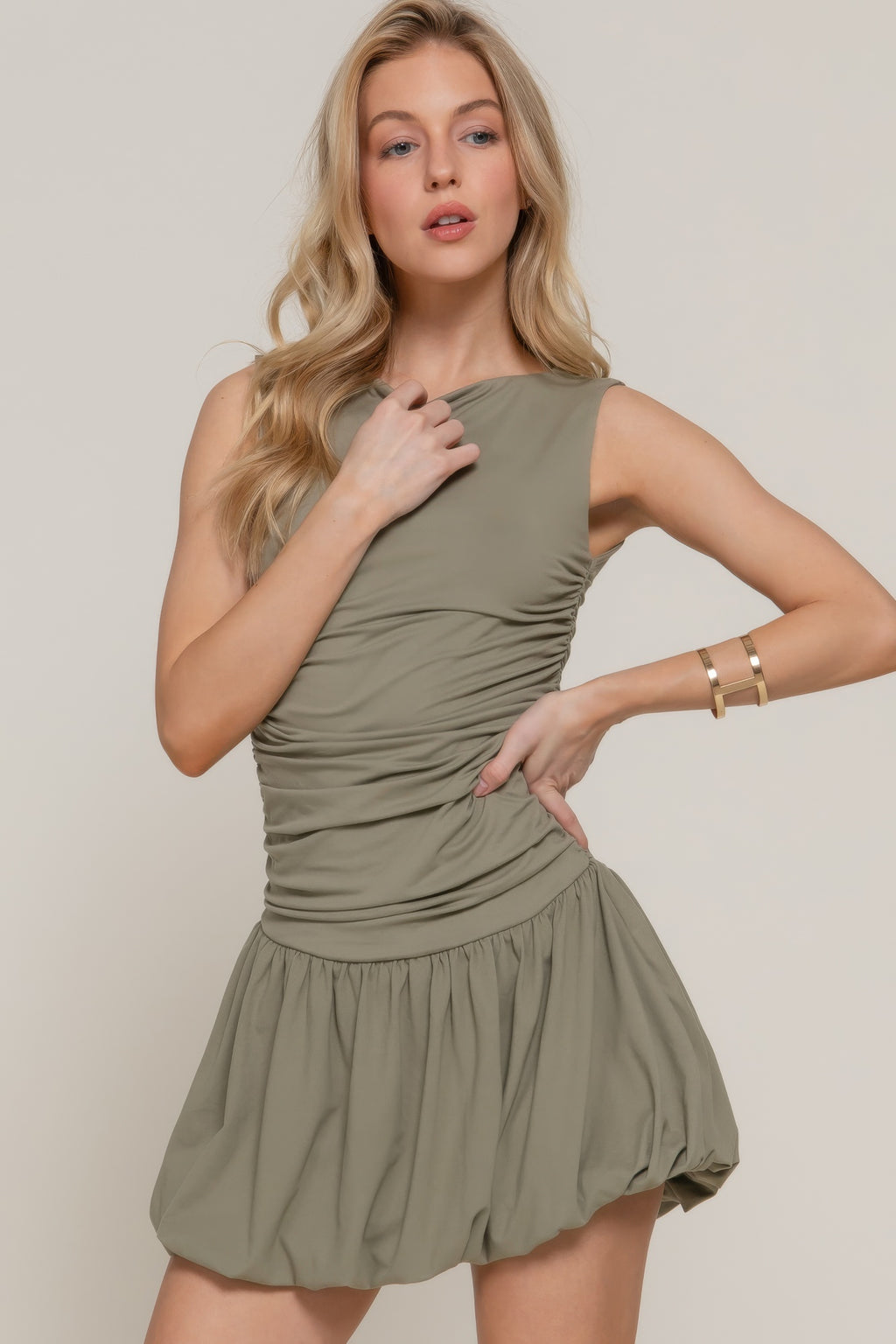 Light olive sleeveless boat-neck mini dress with ruched bodice and flared skirt