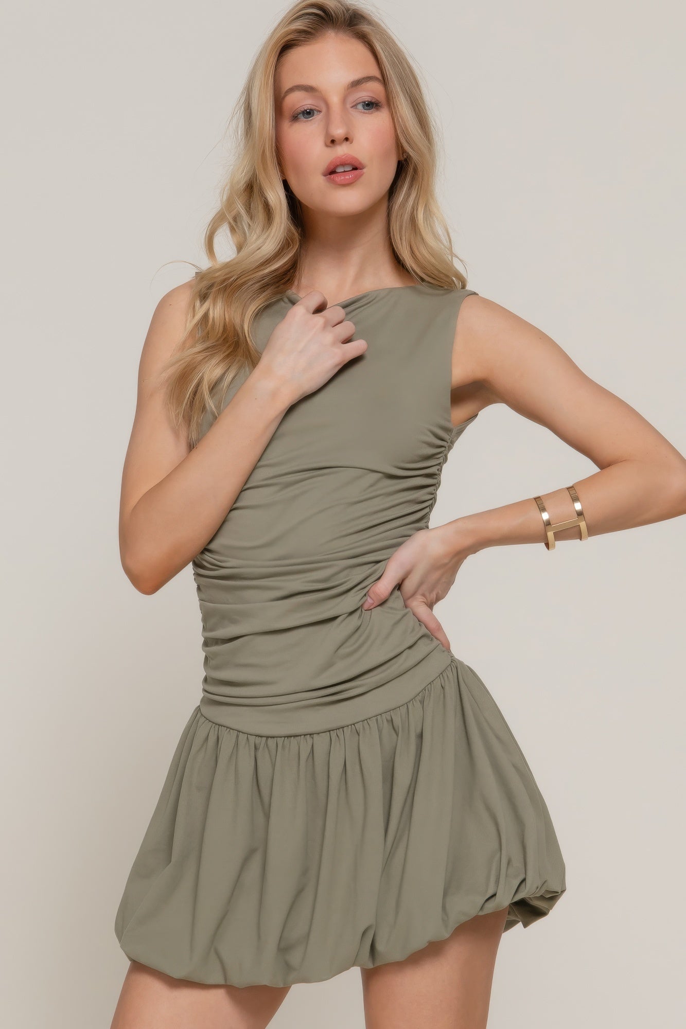 Light olive sleeveless boat-neck mini dress with ruched bodice and flared skirt