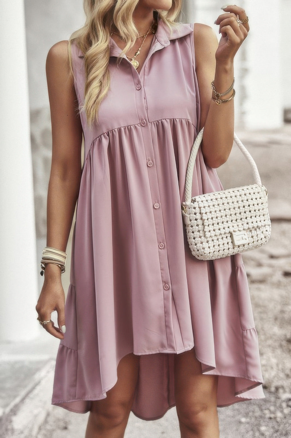 Light pink sleeveless peplum shirt dress with V-neck collar and button placket