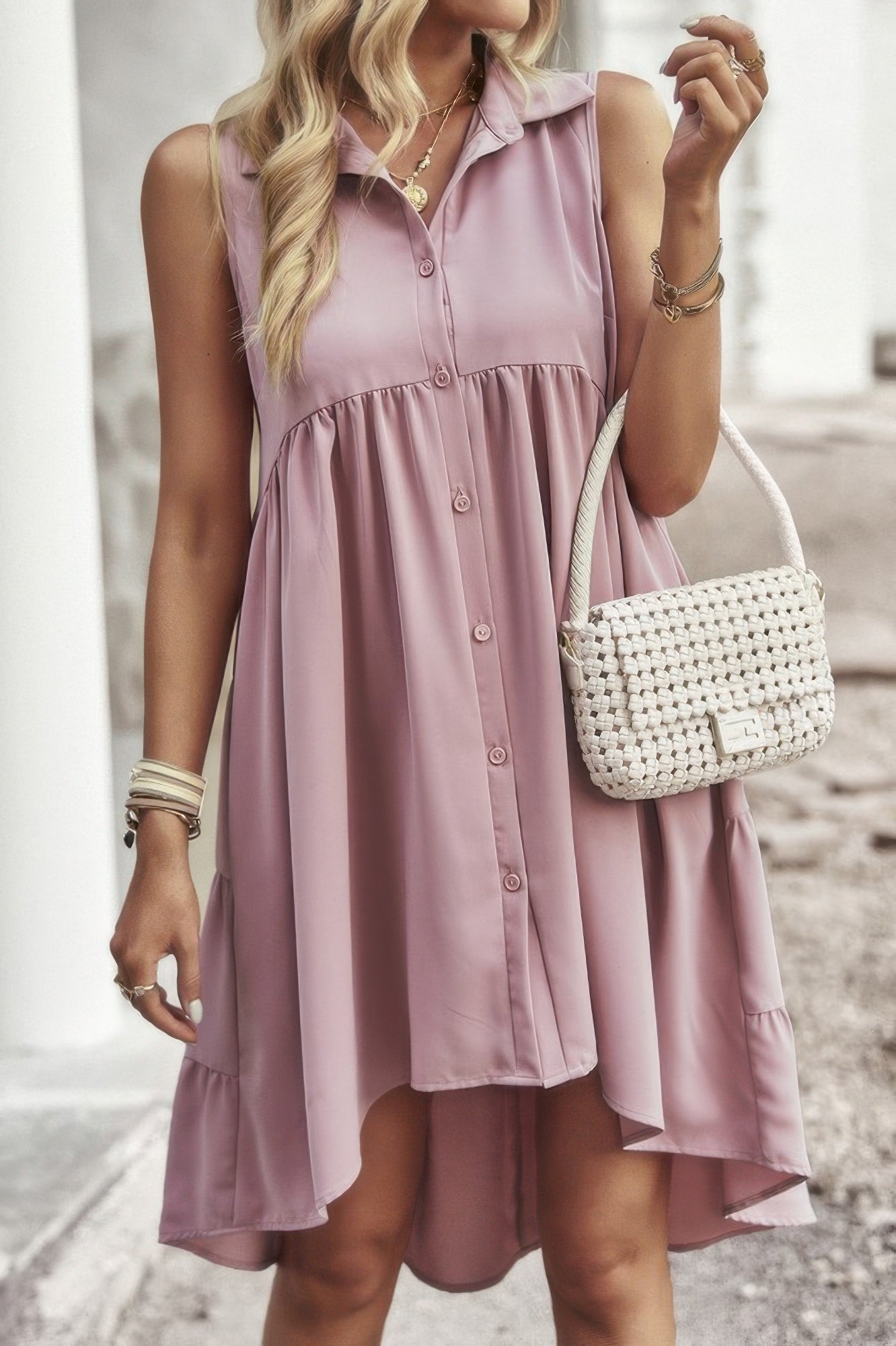 Light pink sleeveless peplum shirt dress with V-neck collar and button placket