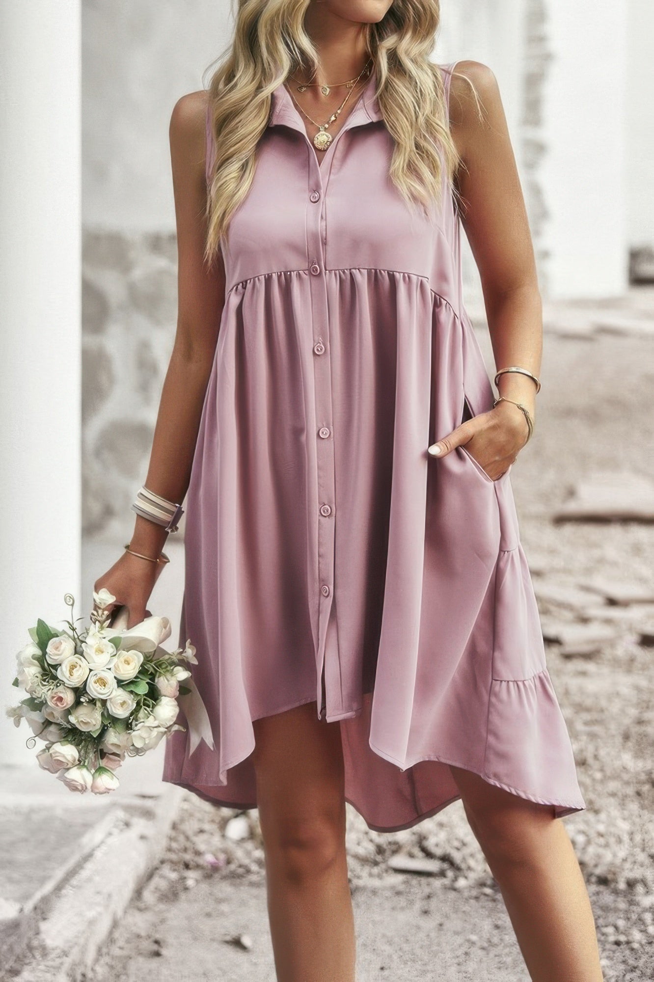 Pink sleeveless peplum shirt dress with asymmetric tiered hem and button details