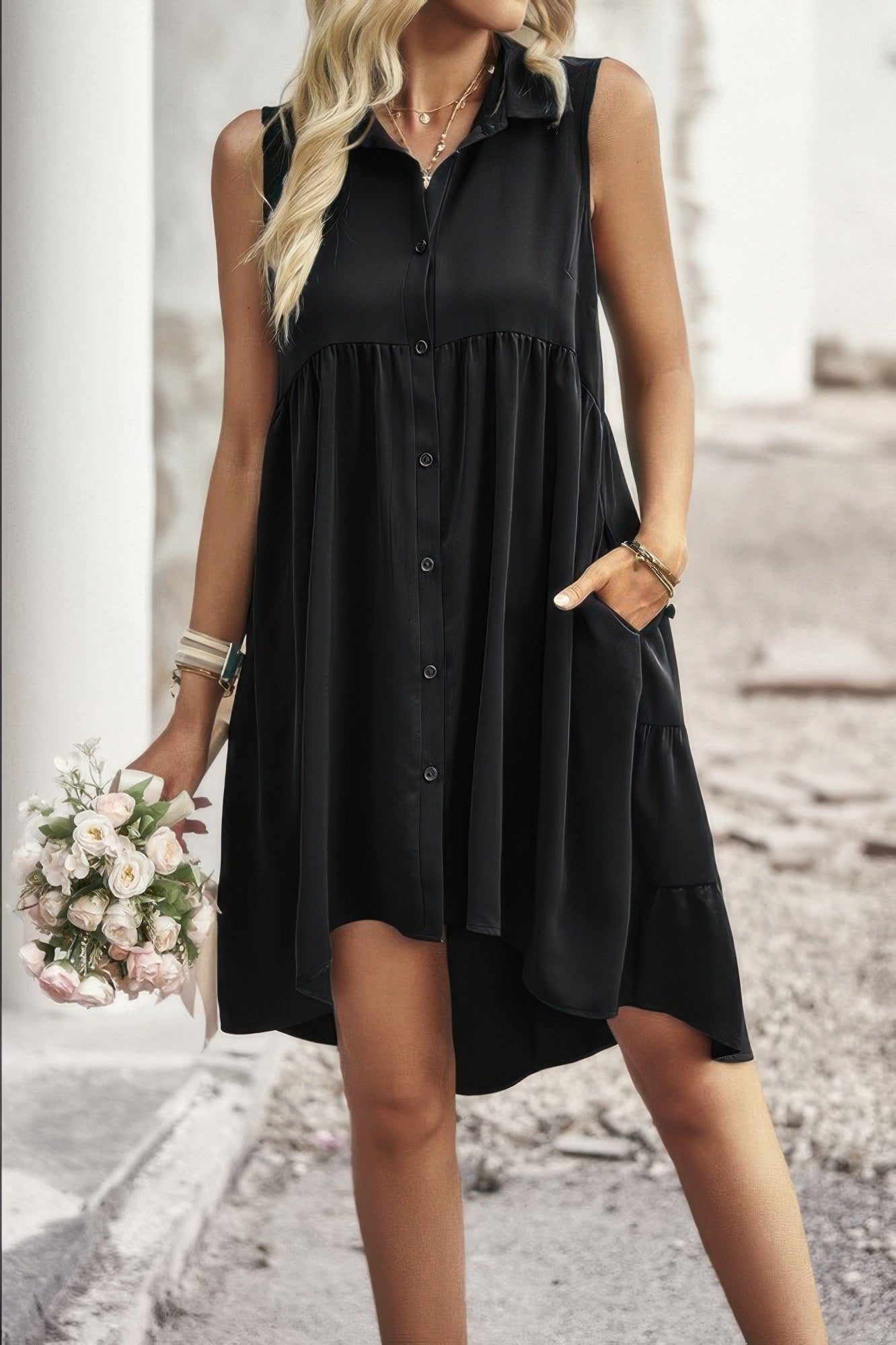 Black sleeveless peplum shirt dress with button-front and flared tiered skirt
