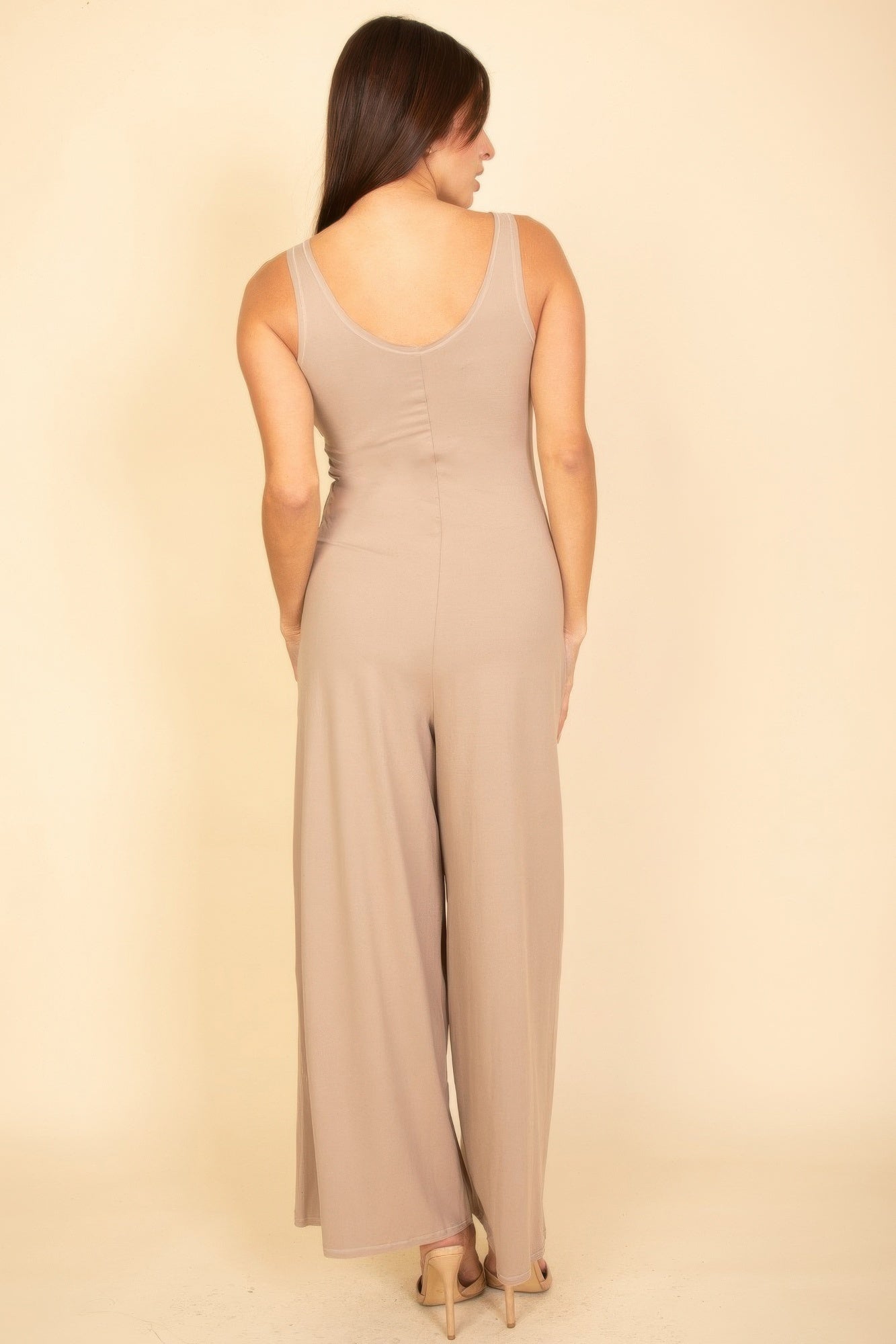 Taupe sleeveless wide-leg jumpsuit, scoop back and flowing wide-leg drape