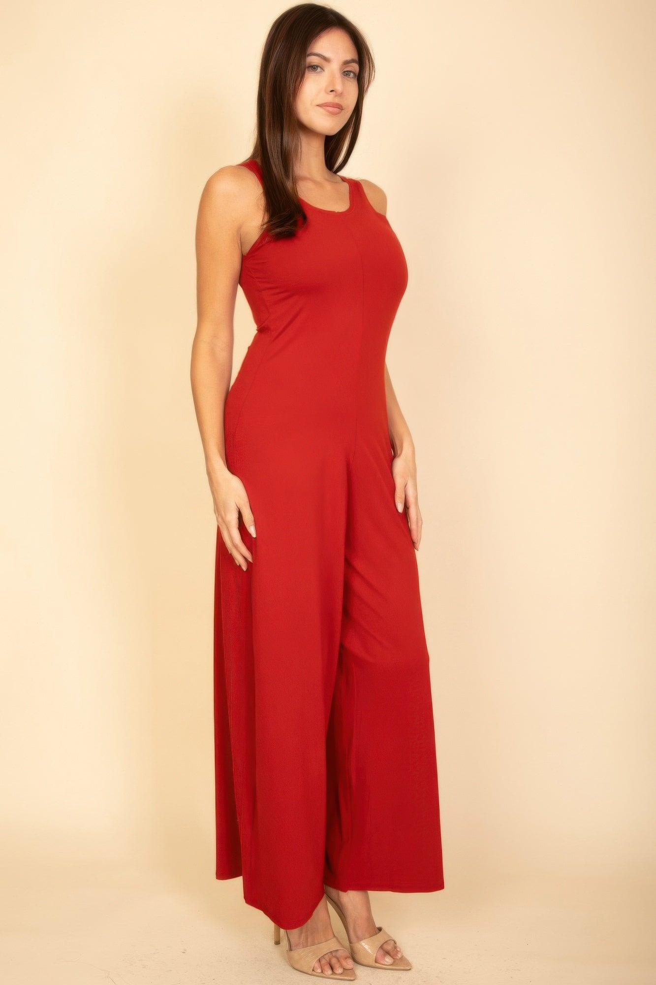 Red sleeveless wide-leg jumpsuit with slim torso and flowing wide bottoms