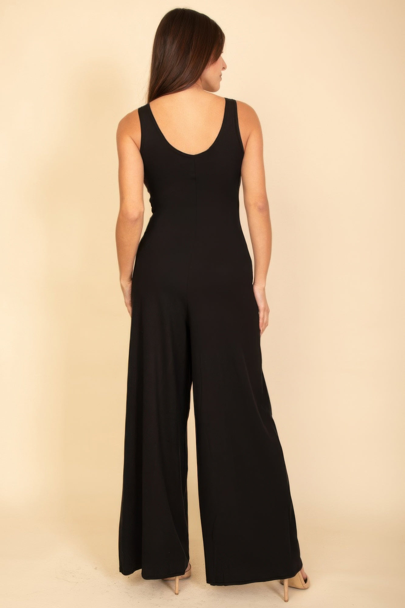 Black sleeveless tank wide-leg jumpsuit from back view, scoop back neckline