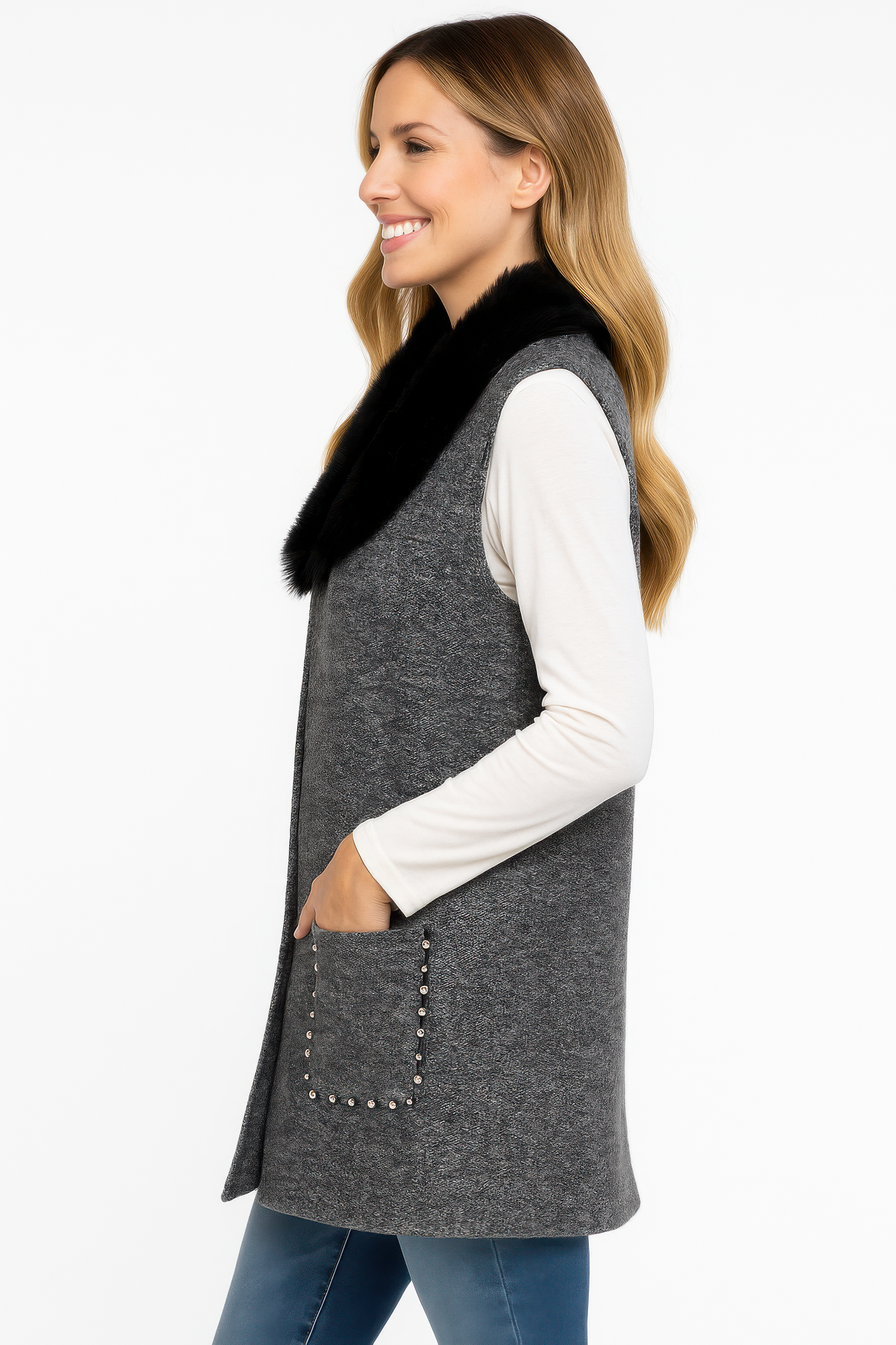 Side view: gray sleeveless vest with black faux fur collar and studded pocket detail