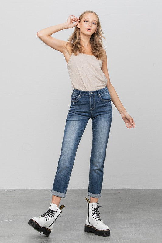 Dark slim boyfriend jeans, front view with fly button closure and classic five-pocket design.