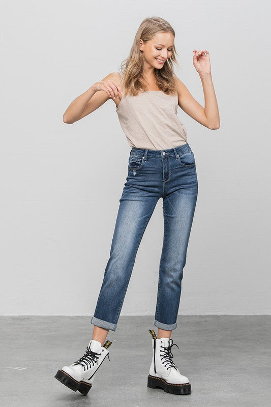 Dark slim boyfriend jeans, front view with button closure, belt loops, and five-pocket styling.