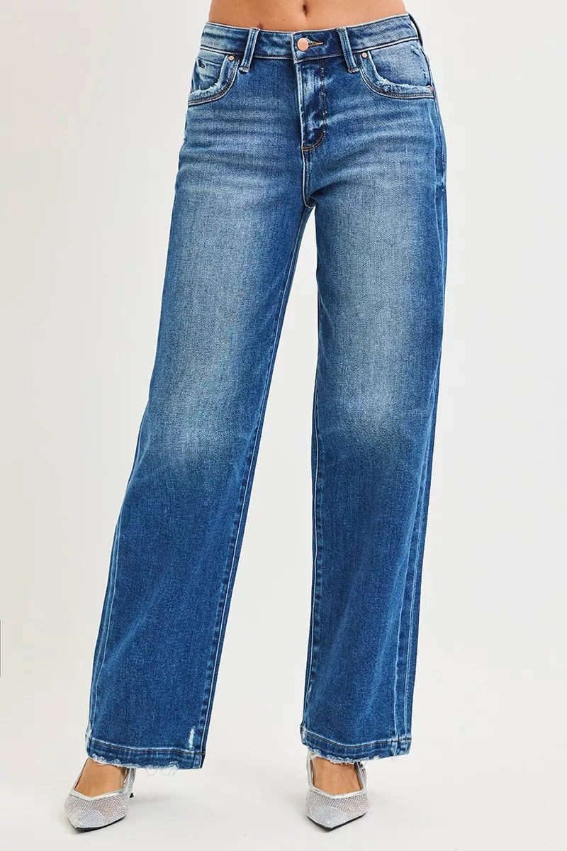 Front view baggy blue jeans with button fly and classic five-pocket styling