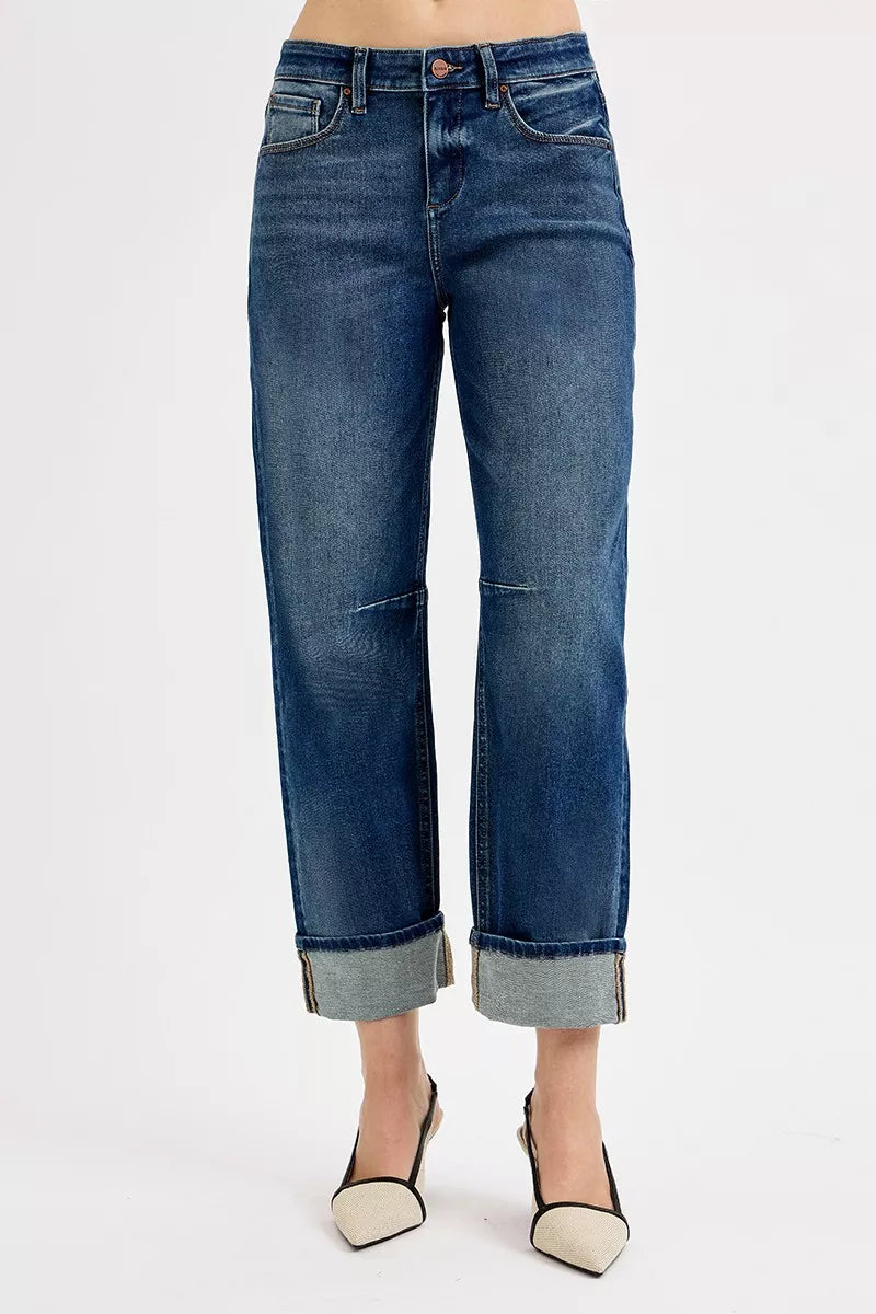 Dark blue cropped jeans with cuffed hem and side seam patch detail