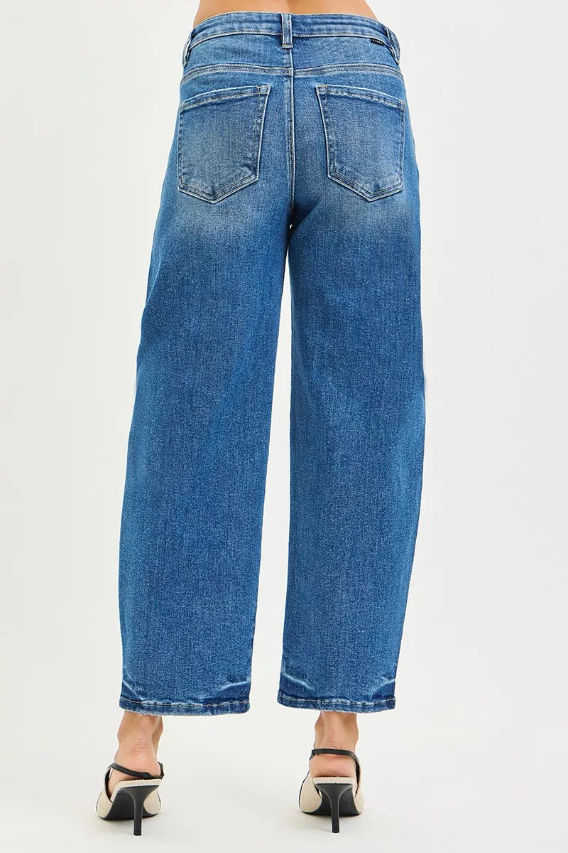 Medium blue cropped barrel jeans with two back pockets and relaxed wide leg