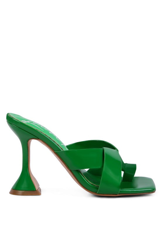 Green heeled mule sandals with intertwined toe ring straps and sculpted heel