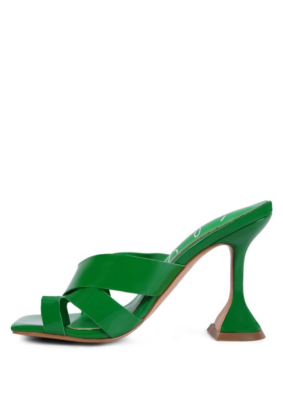 Green toe ring heeled sandals with crisscross straps and chunky block heel, angled