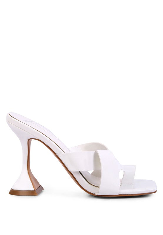 White mule-style heeled sandals with intertwined toe ring strap