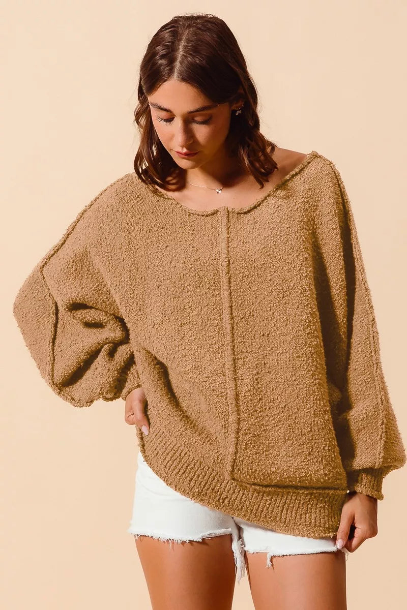 Taupe bouclé sweater with exposed center seam, relaxed slouch fit, ribbed hem and cuffs