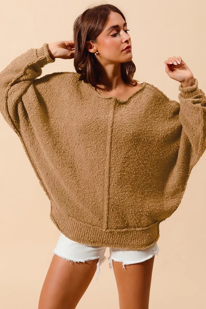 Taupe bouclé slouch sweater with off-shoulder neckline, exposed seams, comfy oversized sleeves