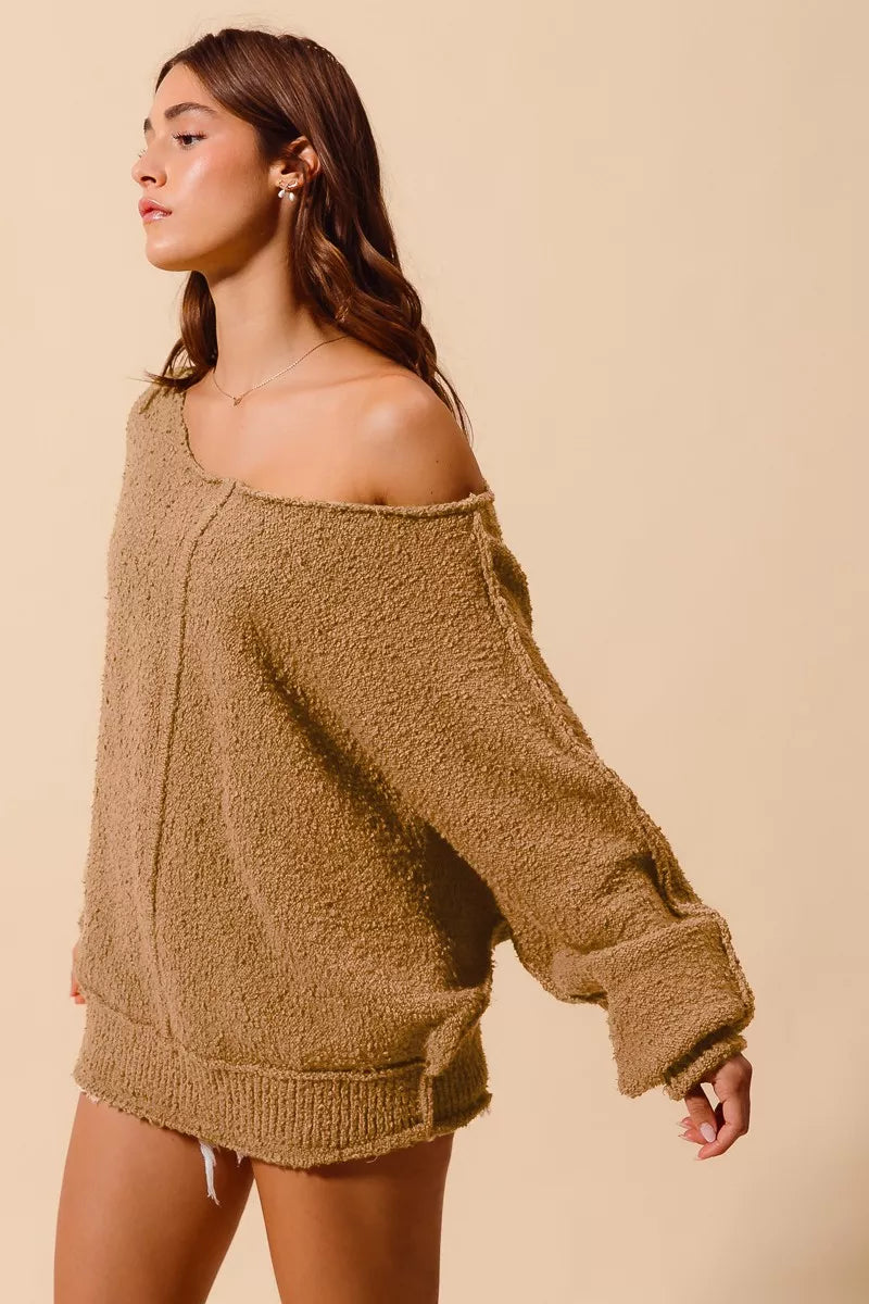 Taupe bouclé slouch sweater with asymmetrical off-shoulder neckline, long sleeves, loose body