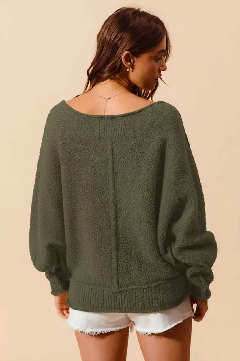 Olive back of slouchy sweater with exposed center seam and dropped batwing sleeves