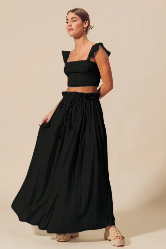 Black smocked square-neck crop top with gathered maxi skirt, side view