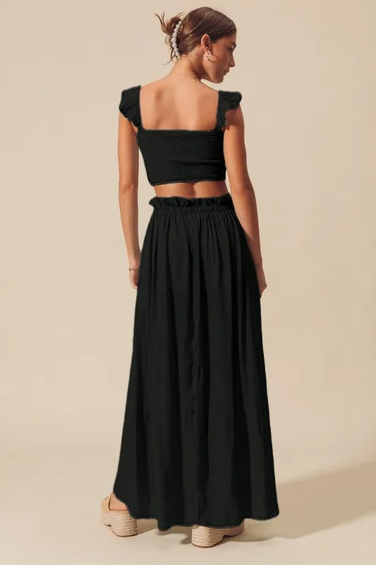 Black back view: smocked crop top and full gathered maxi skirt