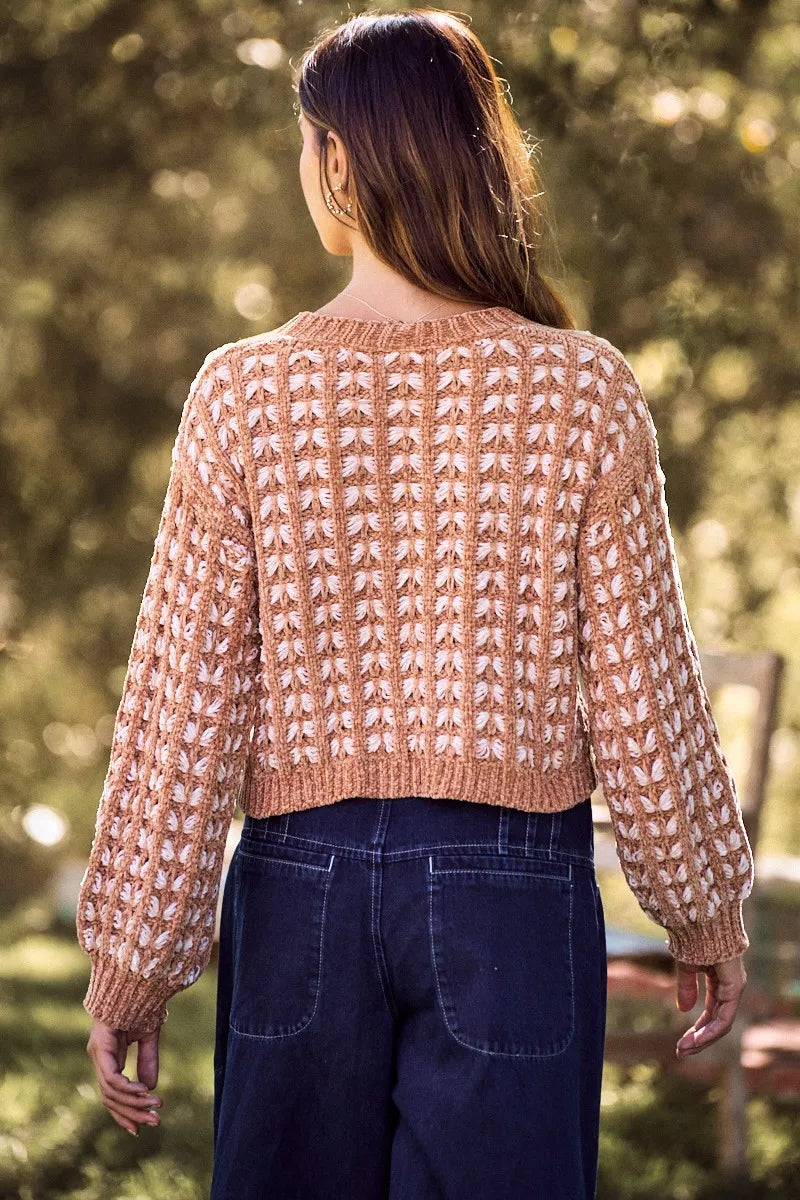 Back view of camel chenille button cardigan with textured pattern and ribbed hem