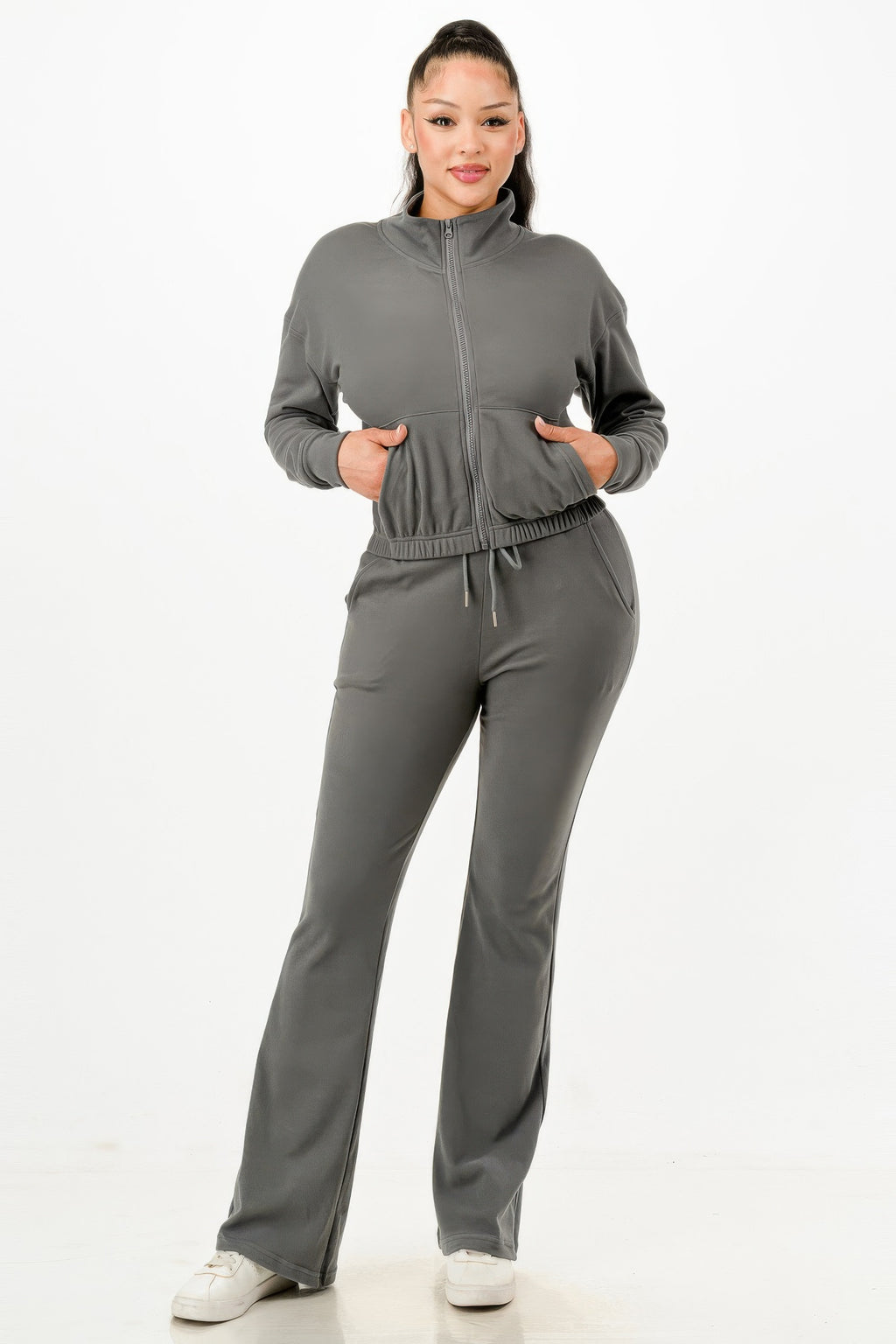Gray zip-up track jacket and flared pants set with elastic waist and drawstring, front.
