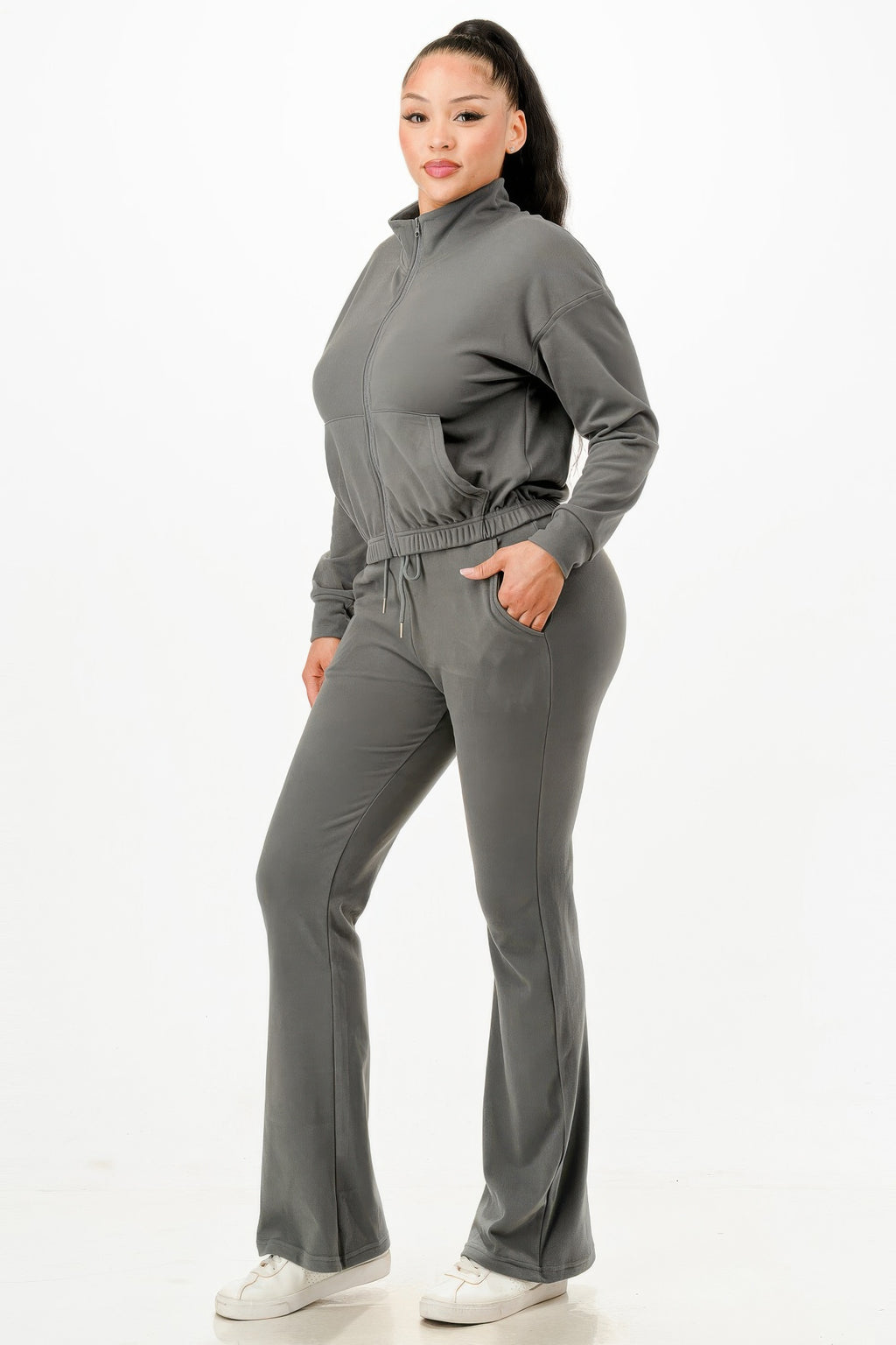 Gray zip-up track suit set shown side view: elastic waist drawstring pants, long sleeves.