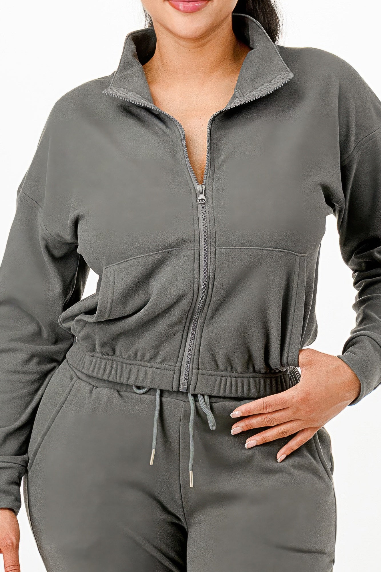 Close-up gray zip jacket: stand collar, front pockets, elastic waist band, drawstring pants.