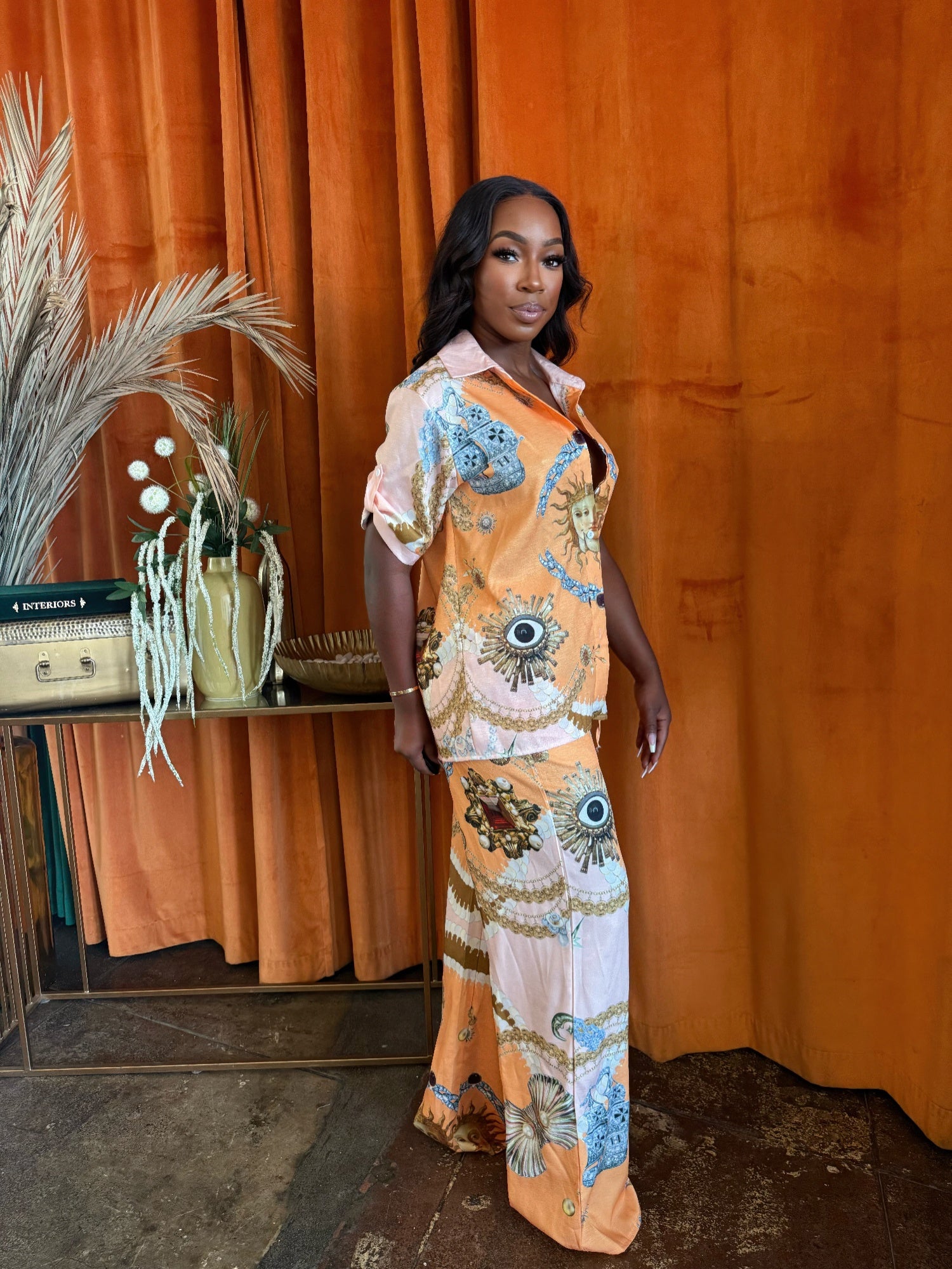 Solar Muse set: front button shirt with ornate blue-and-orange print, matching pants