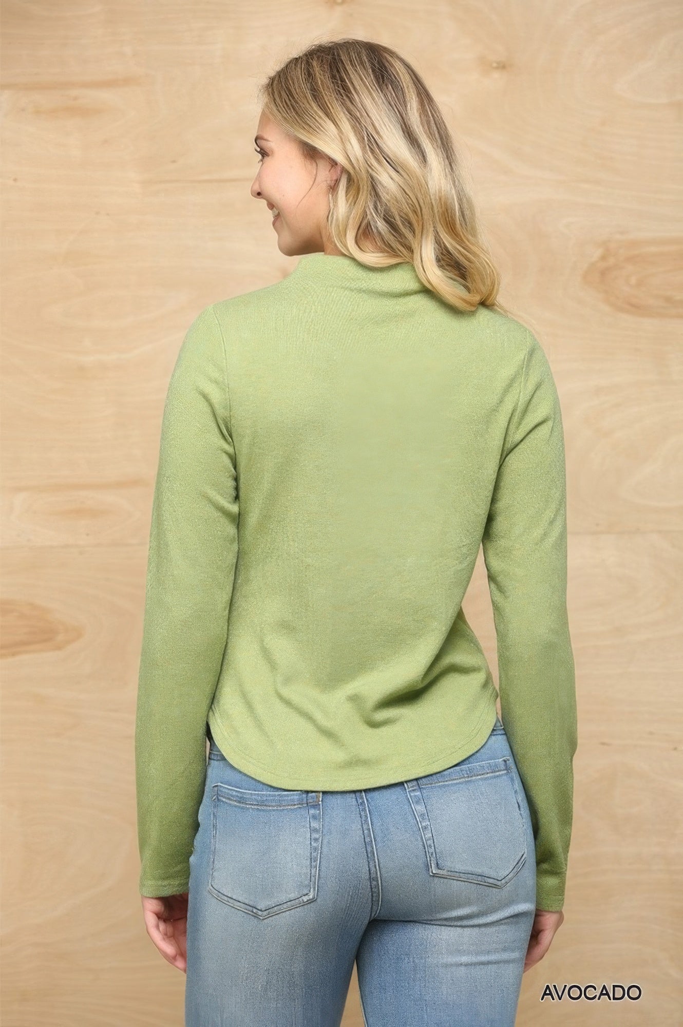 Back view: avocado green mock neck soft knit top with side ruched shaping
