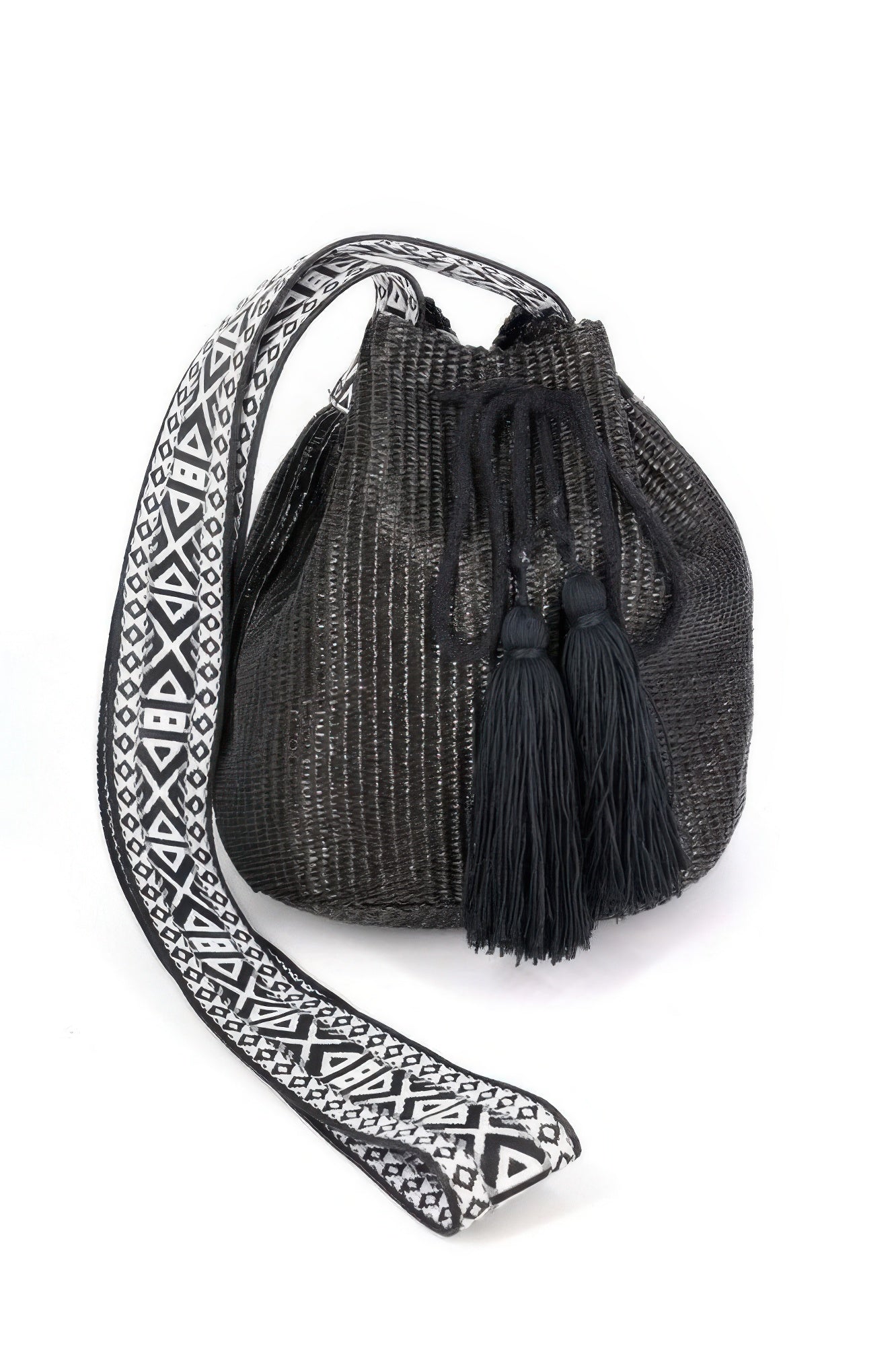 Solid bucket bag with Aztec strap, black woven drawstring top and tassel