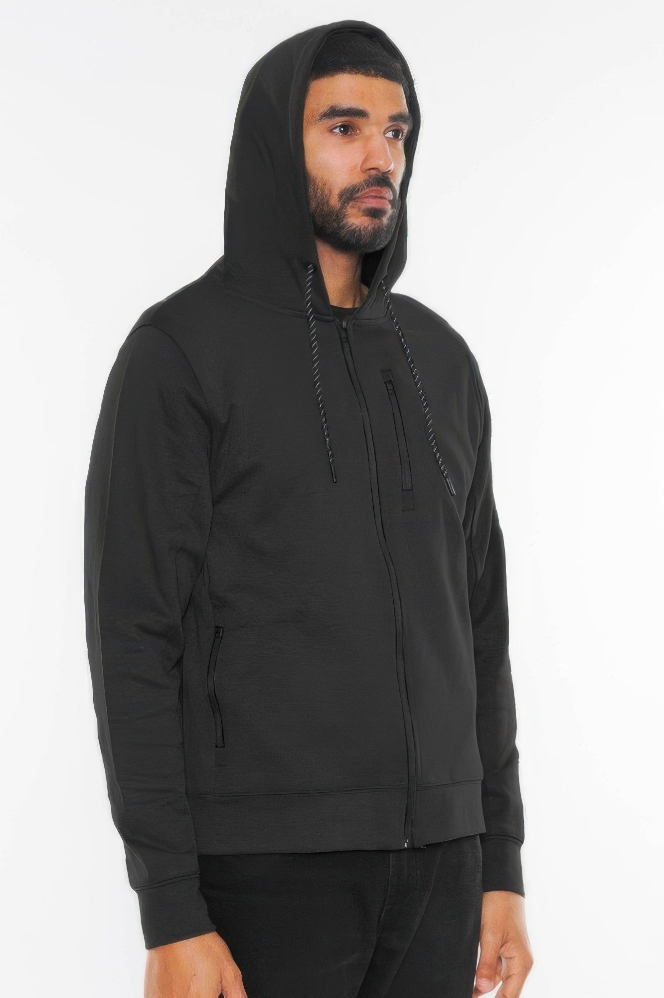 Black zip-up hoodie jacket, side view, with drawstring hood and front zipper