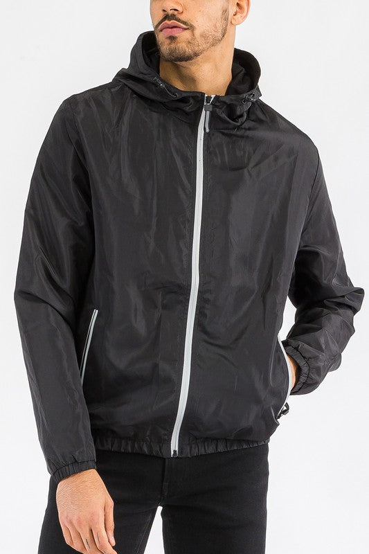 Black lightweight windbreaker jacket with full-zip, hood, and elastic cuffs.