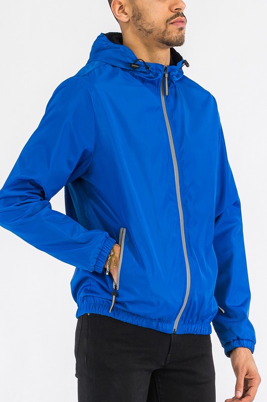 Blue hooded windbreaker jacket with front zipper and adjustable cuff