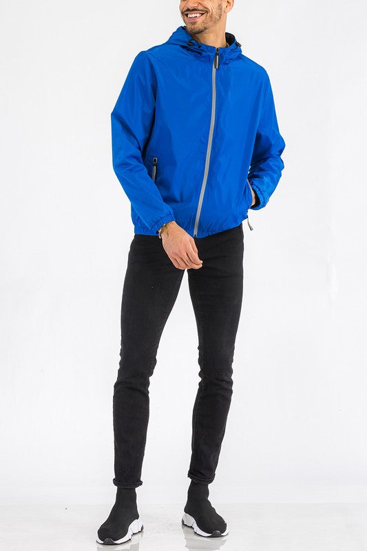 Lightweight hooded windbreaker jacket, blue, front view with full zipper