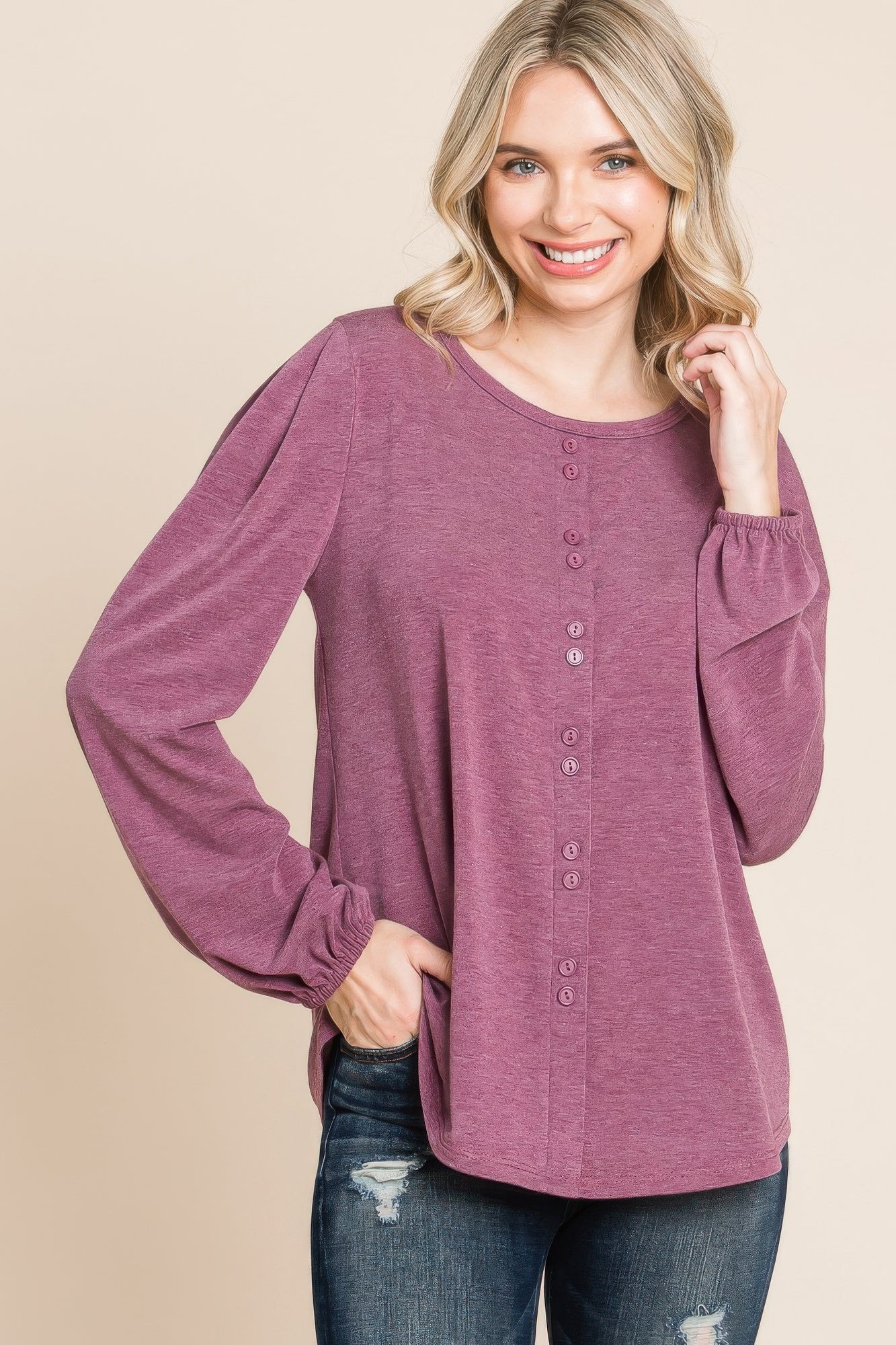Burgundy long sleeve Henley top with vertical button placket and gathered cuffs